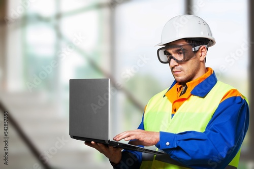 Young male technician worker repairs house
