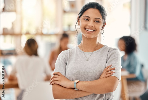 Business woman, designer and portrait of happy employee working, arms crossed and marketing agency, startup and creative company. Smile, happiness and young employee internship at advertising agency