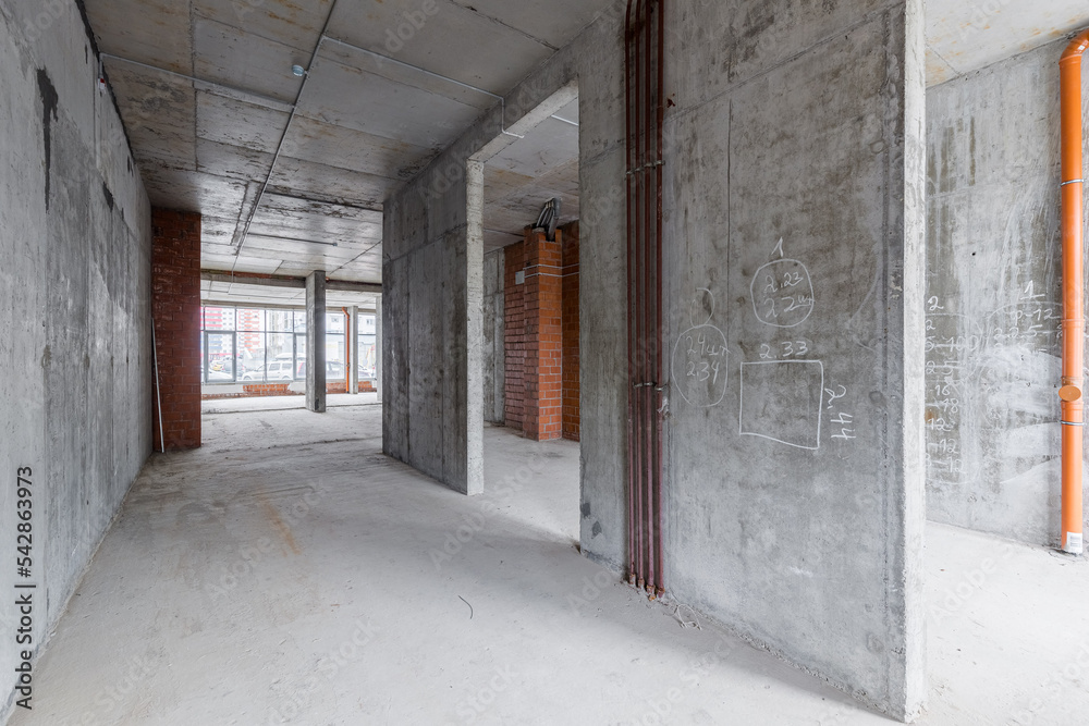 Empty concrete commercial space without finishing with partitions