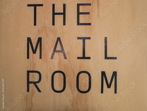 Mail room sign board on the wood background at condominium photo