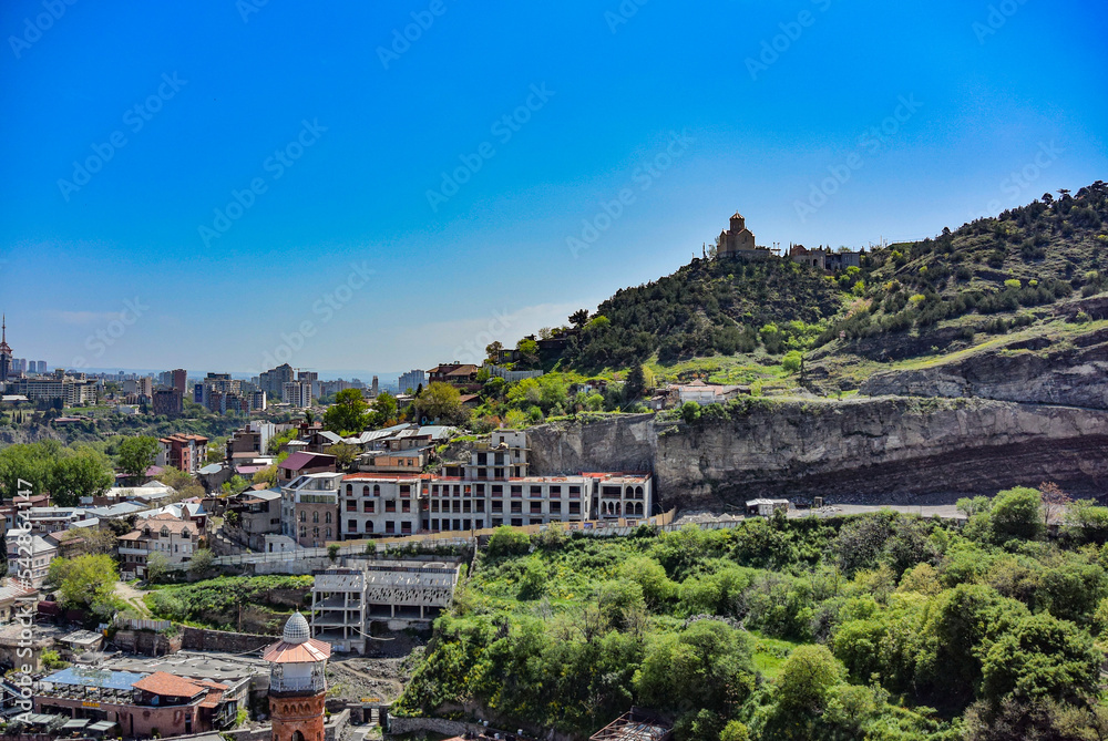 Tbilisi, Georgia-April 28, 2019: beautiful bird's-eye view of the city of Tbilisi and the Transfiguration monastery of Tabor in the distance.