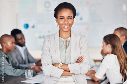 Meeting, team and portrait of black woman, leader or manager standing with pride, confidence and happiness. Communication, collaboration planning and business people team work on marketing strategy