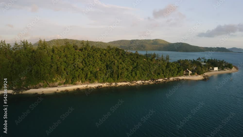 Island with trees and white sand beach in the middle of the ocean Island with trees and white sand beach in the middle of the ocean