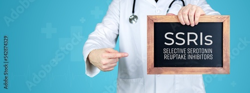 Selective serotonin reuptake inhibitors (SSRIs). Doctor shows medical term on a sign/board photo