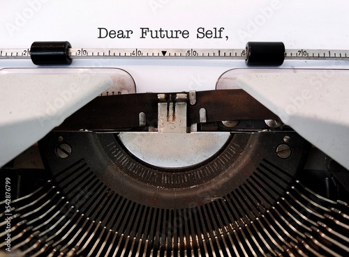 Vintage typewriter with type text DEAR FUTURE SELF, a letter to convey message to future you. specific goals to achieve, follow up on bucket list items or declare important affirmation