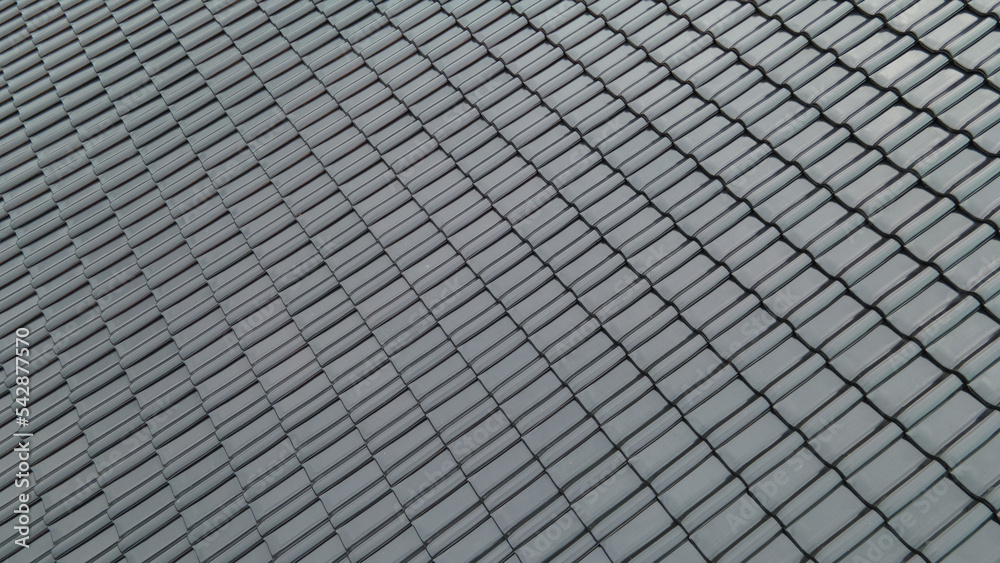 Close up of black, burnt roofing on the roof, construction and building concept Close up of black, burnt roofing on the roof, construction and building concept