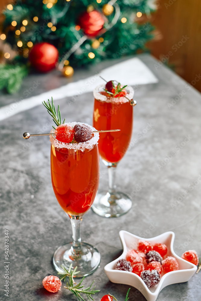 Christmas mimosa punch or cranberry margarita cocktail with cranberry  juice, orange liqueur and champagne. Delicious icy drink for christmas  holiday. Photos | Adobe Stock