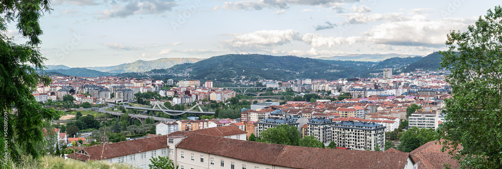 Panorama view of the skyline of the Galician city of Ourense as seen from the outskirts, with the three main bridges to be recognized.