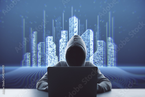 Fotobehang Hacker at desktop using laptop on blue background with abstract creative pixel city hologram