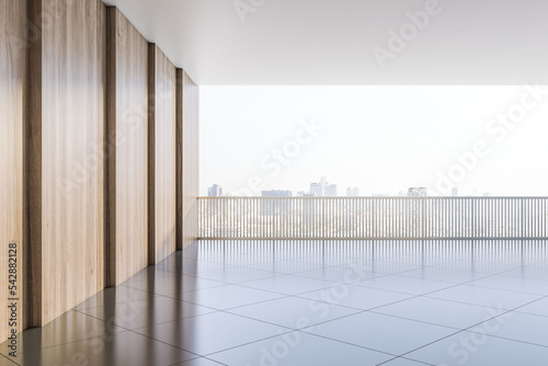 City skyscrapers view on light sky background through metallic railing on spacious area with wooden wall and blank glossy floor for your product presentation. 3D rendering, mock up photo