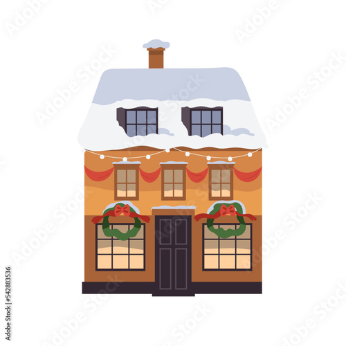 House with Christmas decoration in Europe town. Winter holiday home building ...