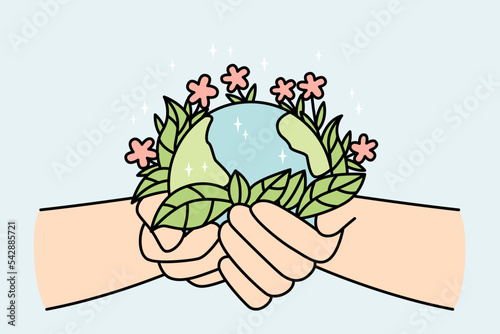 Person hands holding planet earth with blooming flowers. Activist or volunteer take care of environment. Nature protection concept. Vector illustration. 