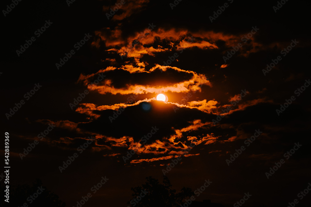 Beautiful sunset sky with golden clouds. Panorama view Beautiful sunset sky with golden clouds. Panorama view