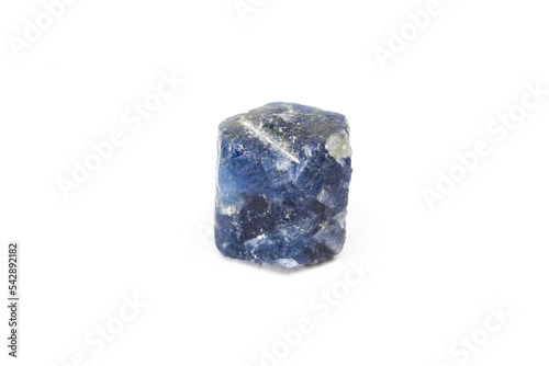 Real raw hexagonal deep blue sapphire, aluminium corundum crystal uncut natural stone macro isolated on a white surface background photo