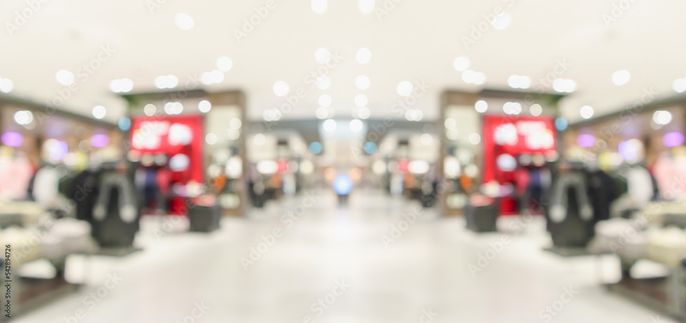 Fototapeta premium Abstract blur clothing boutique display interior of shopping mall background
