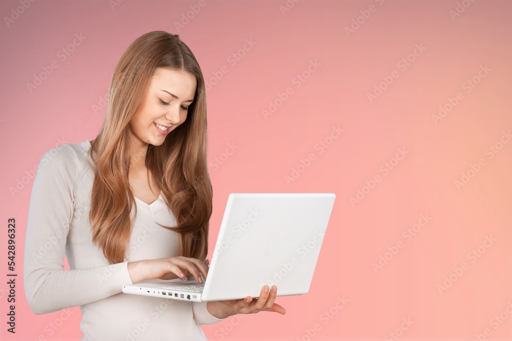 Young happy businesswoman works on laptop Young happy businesswoman works on laptop