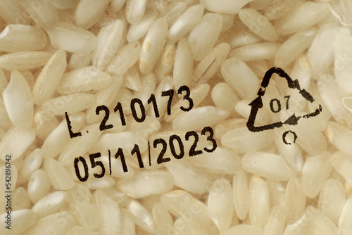 Close-up of expiration date on white rice packaging photo