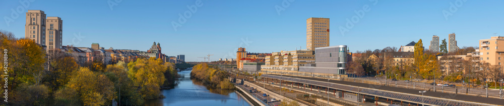 Panorama view over the canal Karlberkskanalen between the districts Kungsholmen and Vasastan, apartment and office building, train yard, a sunny autumn day in Stockholm