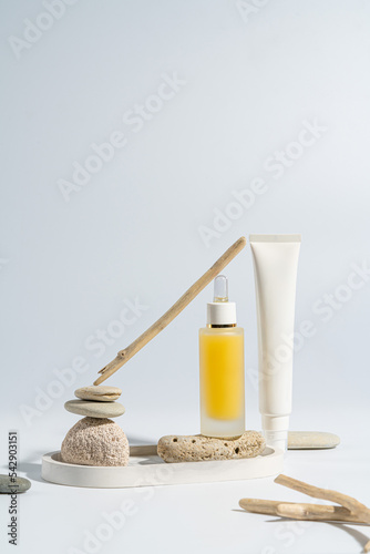 Two bottles for cosmetics without a logo on a light background. Mockup cosmetics
