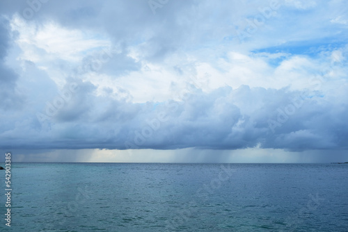 The monsoon season of Rasdhoo, with heavy gray cloud and rain, Maldives.