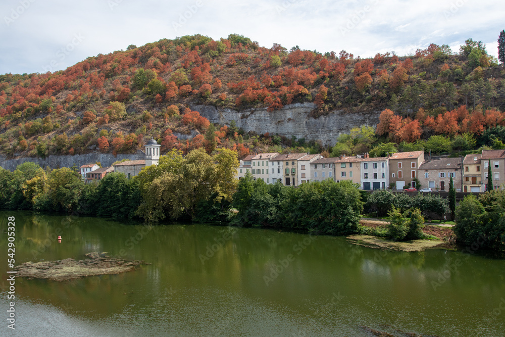 Drought turns trees brown in mid summer on the hills along the river Lot in Cahors, France . Seen from the Loius Philippe bridge
