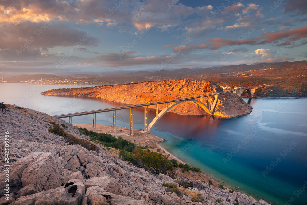 Krk Bridge, Croatia. Image of Krk Bridge which connects the Croatian island of Krk with the mainland at beautiful summer sunset.