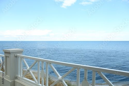 Simple white balustrade near beautiful tranquil sea © New Africa