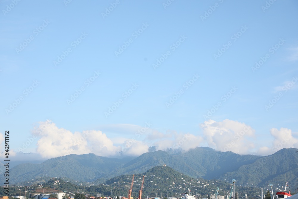 Picturesque view of modern city near mountains
