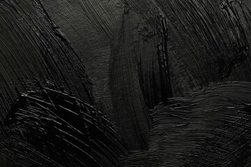 Beautiful strokes of black paint as background, closeup