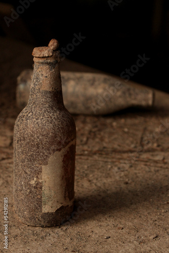 old bottles in a lost place, beer, drinking, abandoned photo