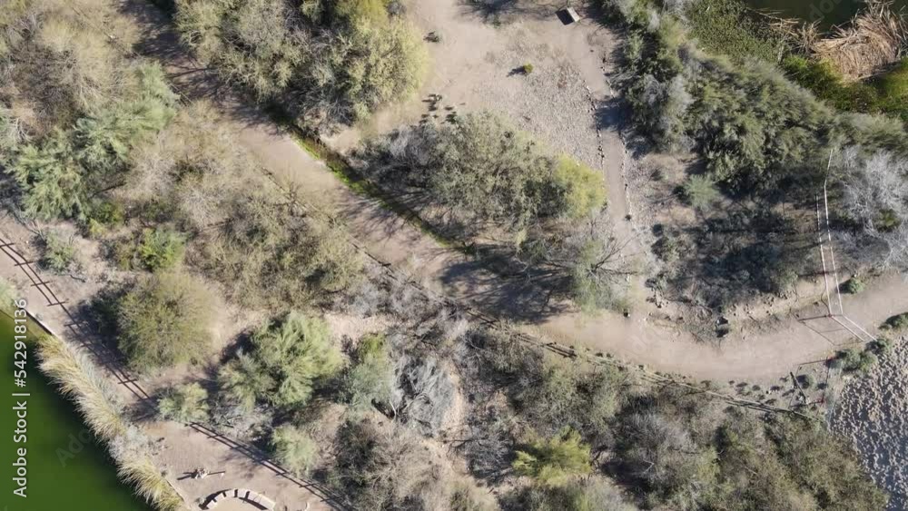 Drone looking down at desert landscape and green river in a park outside Phoenix Arizona, Untied States. Drone looking down at desert landscape and green river in a park outside Phoenix Arizona, Untied States.