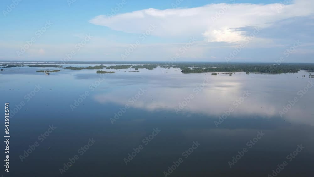 Aerial Flying Over Calm Reflective Floodwaters In Sylhet, Bangladesh. Dolly Forward Aerial Flying Over Calm Reflective Floodwaters In Sylhet, Bangladesh. Dolly Forward