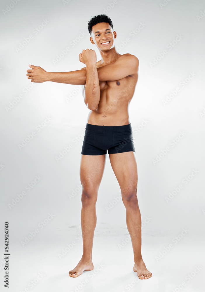 Fitness, stretching and happy topless man, body positive mindset and motivation for healthy lifestyle. Exercise, gym and health workout, fit black man athlete in studio on white background in Brazil.