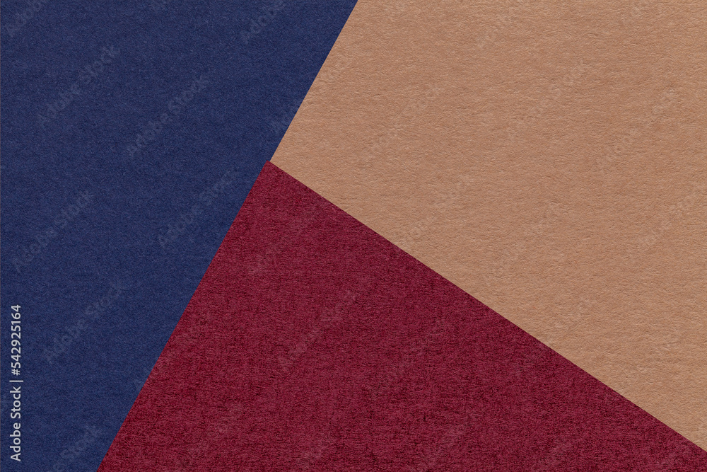 Texture of craft navy blue, wine and brown shade color paper background, macro. Vintage abstract cardboard