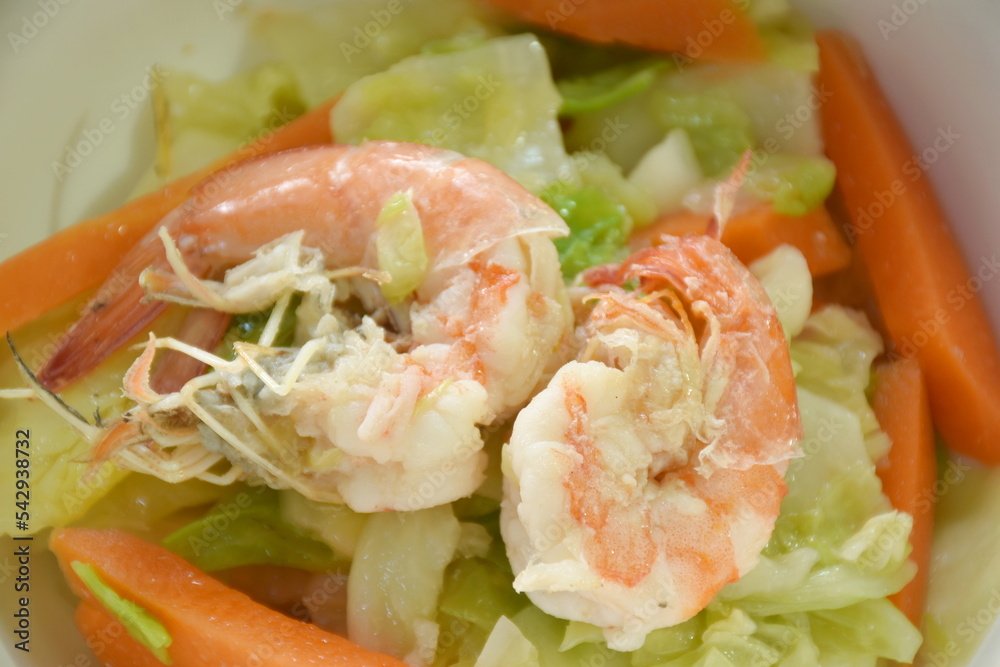 fried slice cabbage and carrot with shrimp in soy sauce on bowl fried slice cabbage and carrot with shrimp in soy sauce on bowl