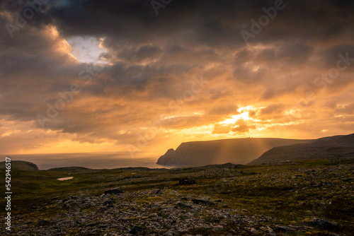 Print op canvas Beautiful sun beams over the North Cape cliff and the Arctic Ocean,  Norway