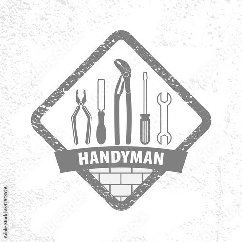 Professional handyman services logo on texture background.  Emblem with set of Repair tools for your desig.  EPS10.