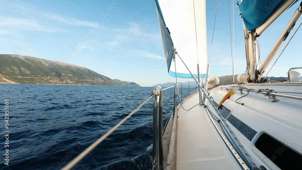 View on sailboat bow, tilted by the wind View on sailboat bow, tilted by the wind