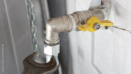 Turn off gas to stove at shutoff valve before disconnecting flexible gas line. photo