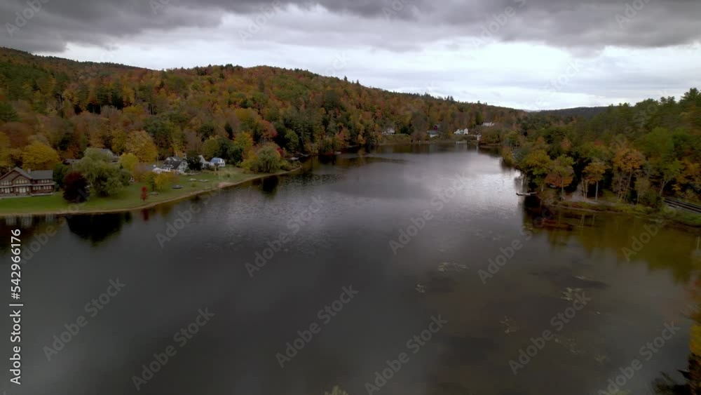 aerial push into mountain lake in the fall in vermont aerial push into mountain lake in the fall in vermont