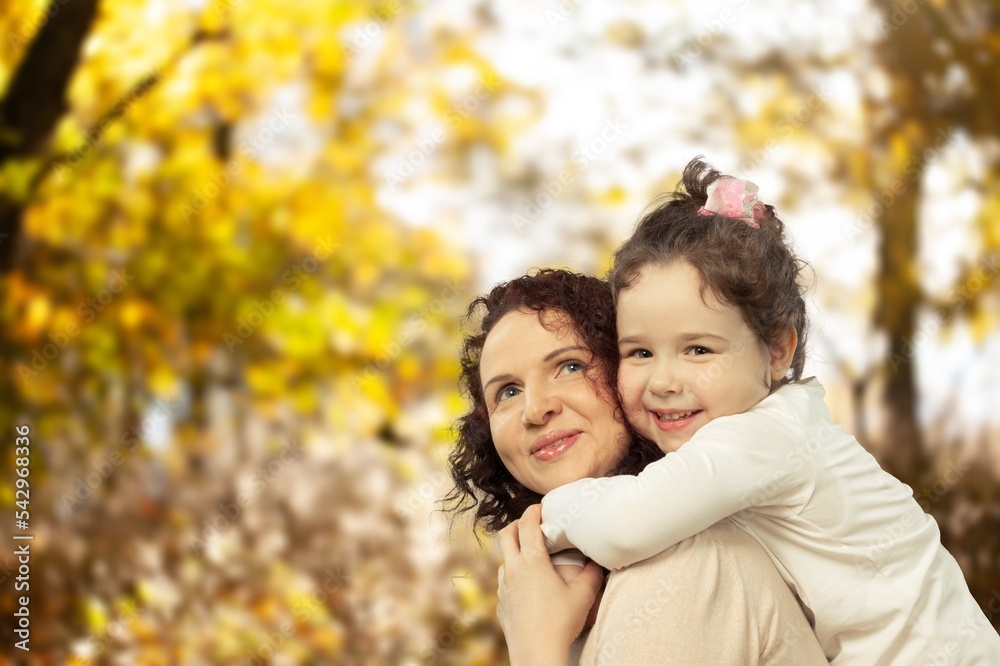 young happy mother with daughter have fun in park young happy mother with daughter have fun in park