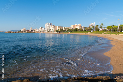 Clear blue sea Vinaros beach Spain one of several beautiful sandy beaches in the Spanish tourist town,  this is Platja de Fora on the Costa del Azahar photo