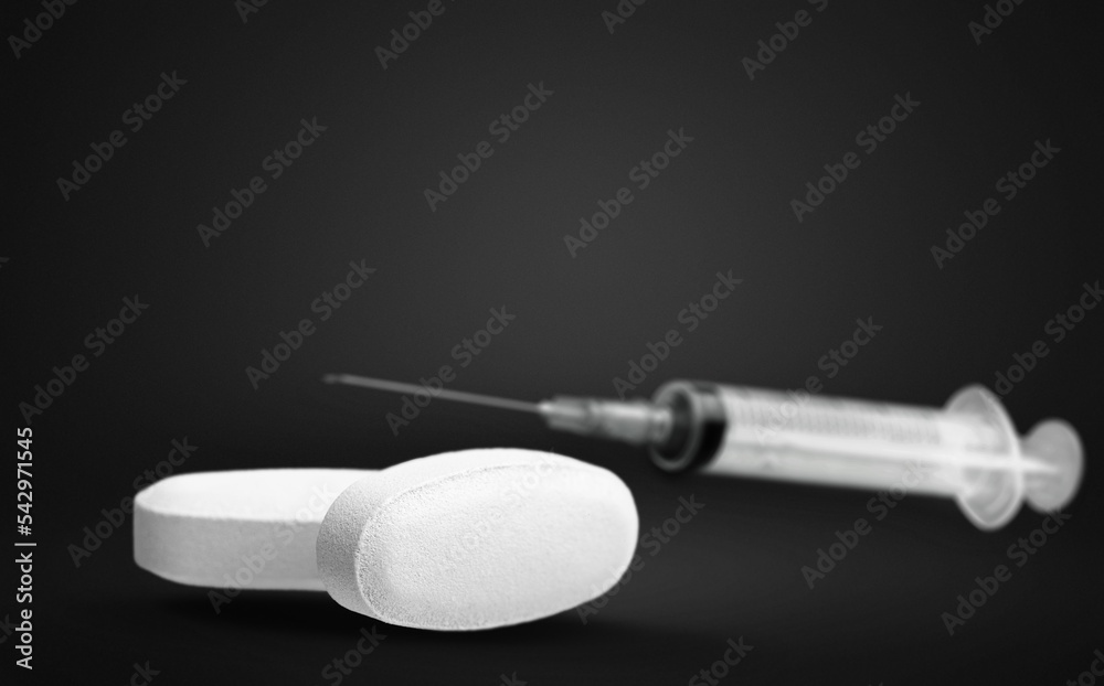 Medical tablet and pill with bottle and syringe, health concept Medical tablet and pill with bottle and syringe, health concept