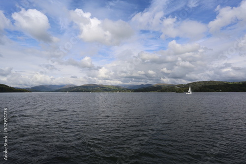 A lonely sailboat on the Lake Windermere, Lake District, England, UK. photo