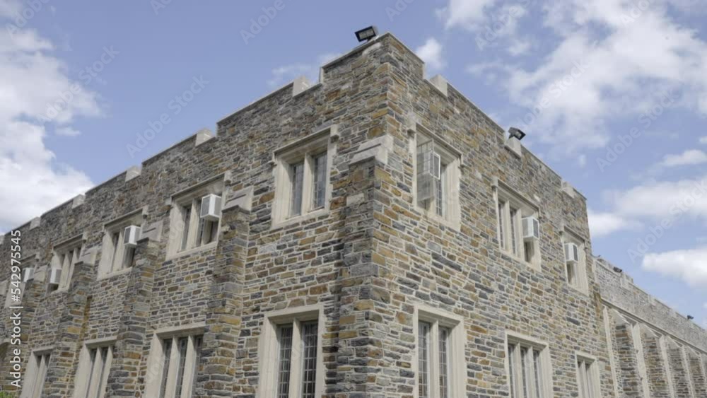 Timelapse of clouds moving over a university building. College. Timelapse of clouds moving over a university building. College.