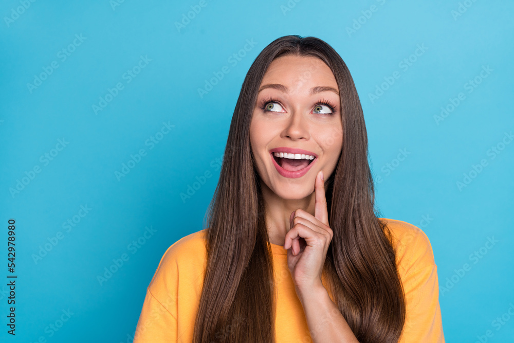 Fototapeta premium Closeup photo of young pretty cute nice woman look interested touch cheeks nice sale shopping deal isolated on blue color background