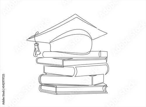 Continuous one single line drawing of Graduation Hat and books stack  photo