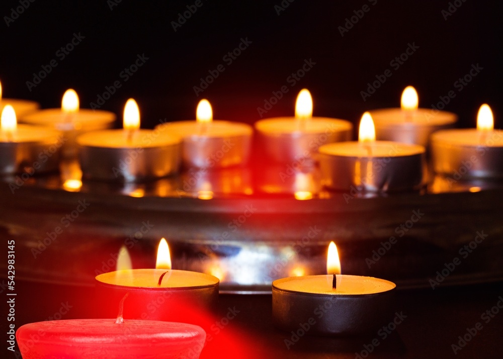 Burning candle light on black background Burning candle light on black background