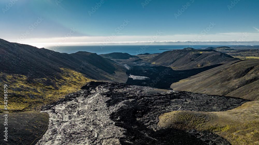 aerial view on valley with steam over solidified lava of Fagradalsfjall volcano