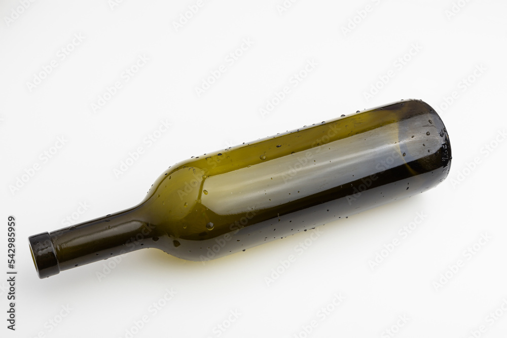 an empty wine bottle without a label on a white background an empty wine bottle without a label on a white background